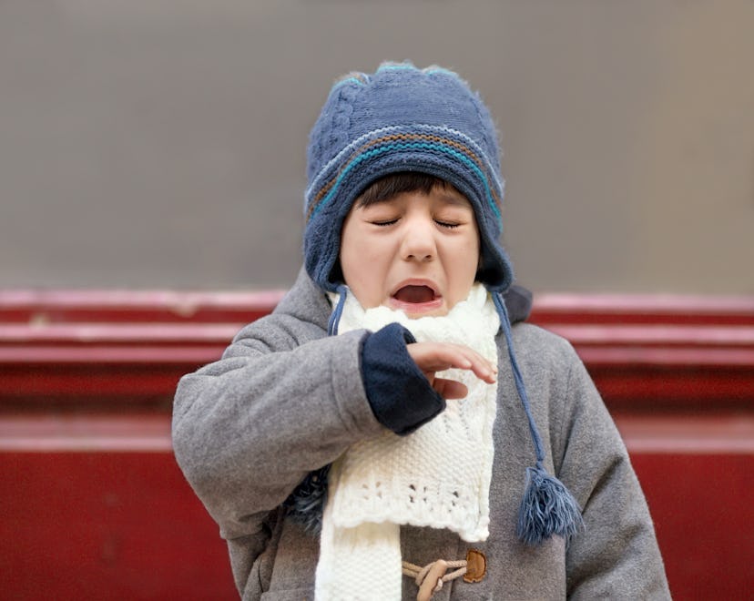 a child sneezes in an article about why is RSV so bad right now