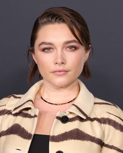 Florence Pugh rocks a slicked-back shag haircut to the world premiere of Netflix's "Don't Look Up" i...