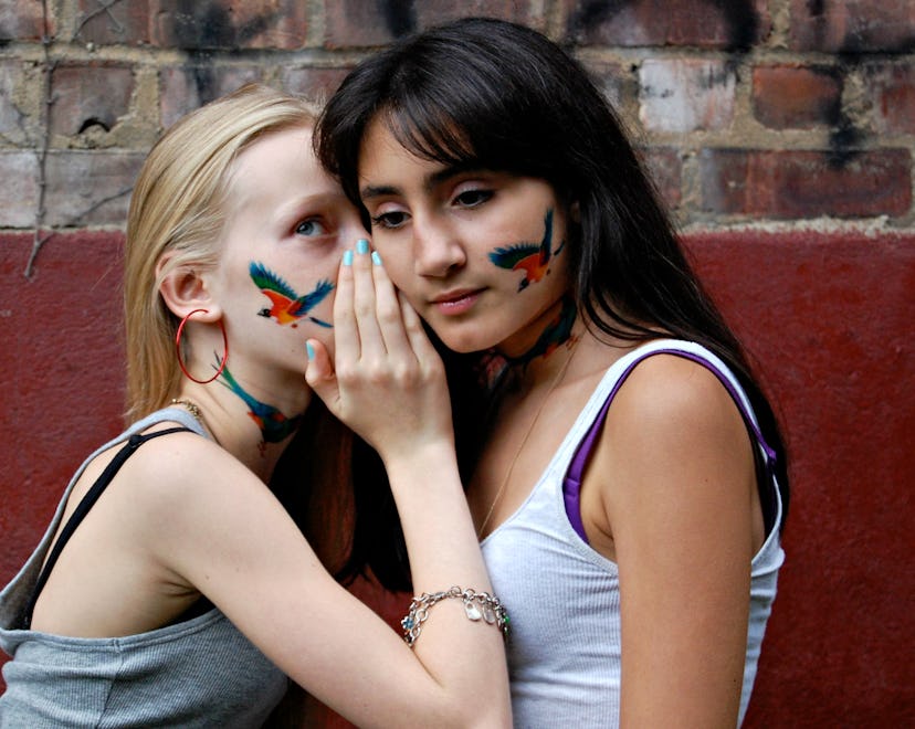 Two girls with temporary tattoos and how to remove temporary tattoos or fake tattoos.