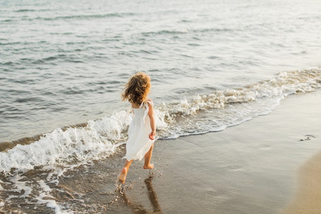 little girl by water in a round up of Scorpio girl names