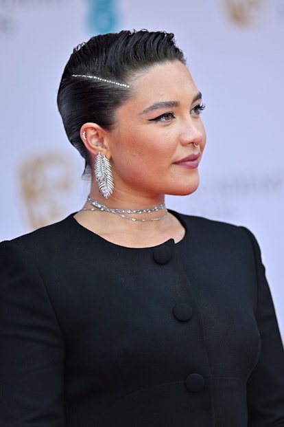 Florence Pugh wears a short pixie haircut to the EE British Academy Film Awards 2022.