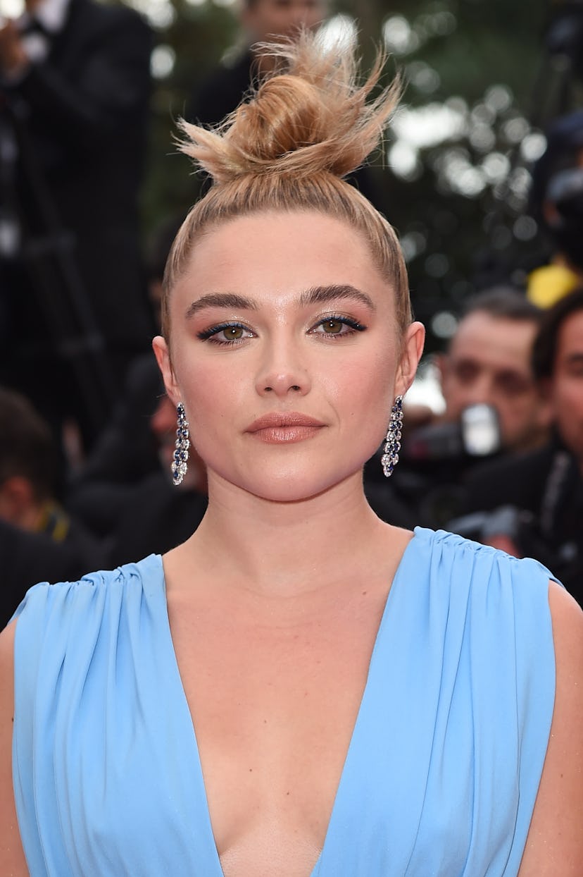 Florence Pugh rocks a messy topknot to the 72nd annual Cannes Film Festival in 2019.
