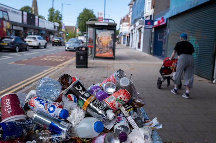 Rubbish piled on top of a waste bin on 31st July 2022 in Birmingham, United Kingdom.
