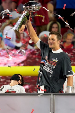 TAMPA, FLORIDA - FEBRUARY 07: Tom Brady #12 of the Tampa Bay Buccaneers hoists the Vince Lombardi tr...