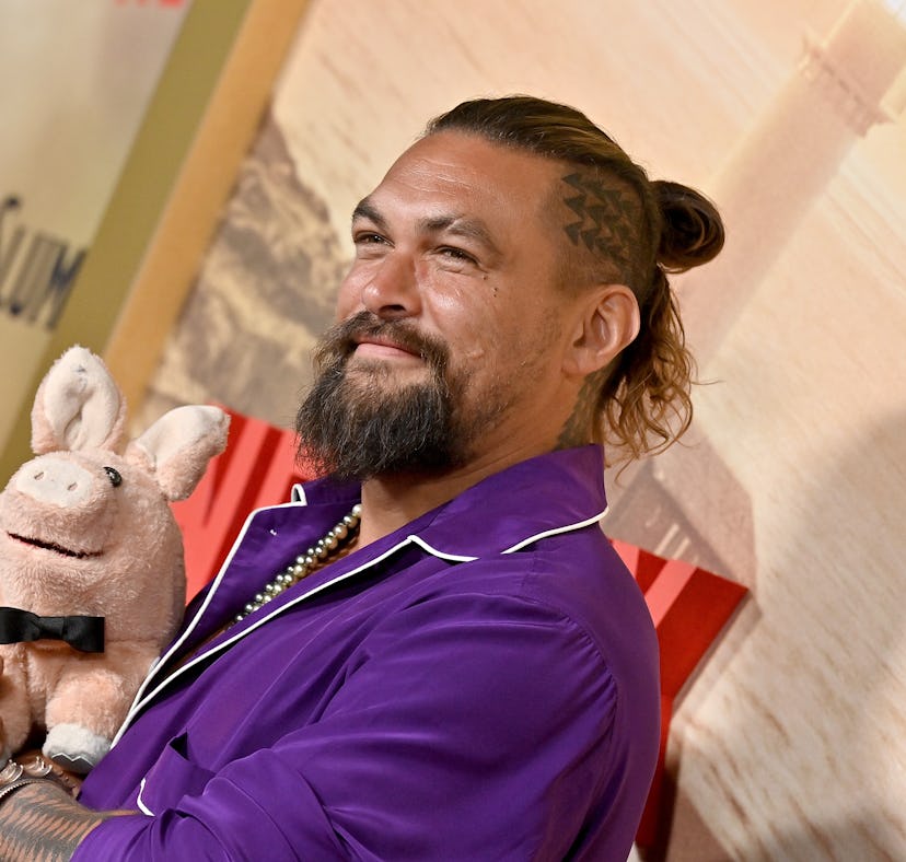 Jason Momoa, with short hair, buzzcut, and head tattoo, attends the Los Angeles premiere of Netflix'...