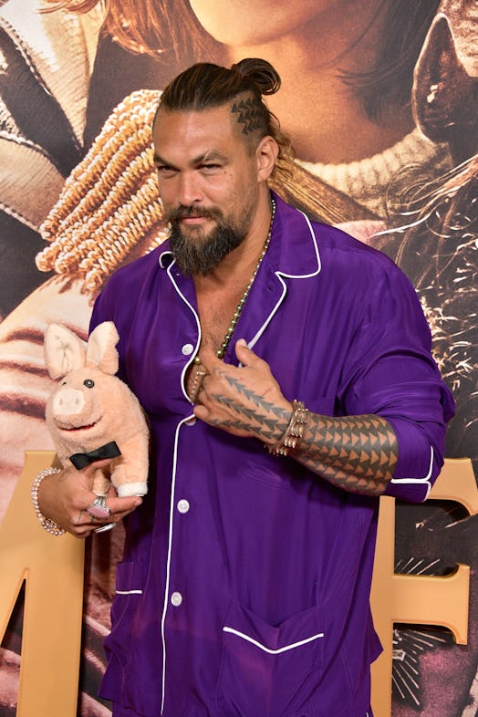 Jason Momoa, with short hair, buzzcut and head tattoo, attend the Los Angeles Premiere of Netflix's ...