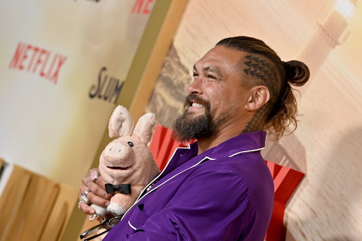 Jason Momoa, with short hair, buzzcut, and head tattoo, attends the Los Angeles premiere of Netflix'...