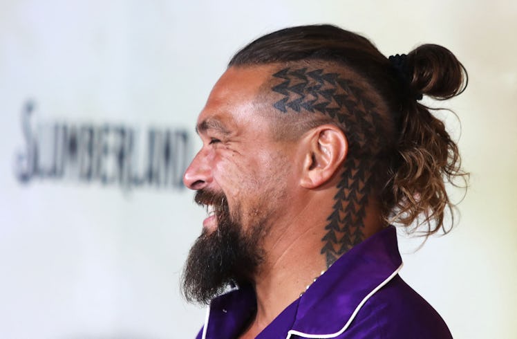 Jason Momoa, with short hair, buzzcut and head tattoo, attend the Los Angeles Premiere of Netflix's ...