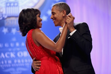 Barack Obama and Michelle Obama dancing.