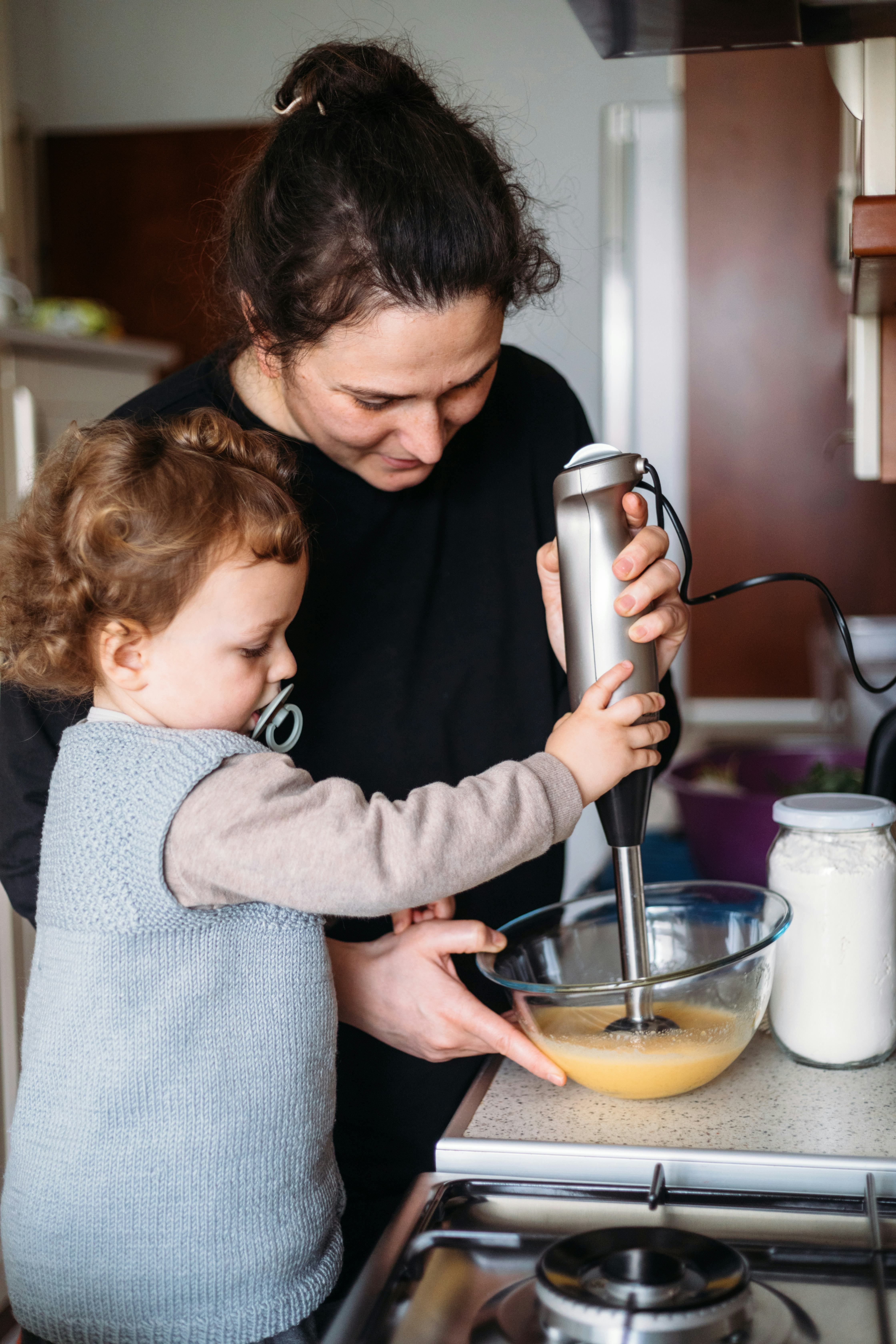 Mom and son making cake for mothers day
