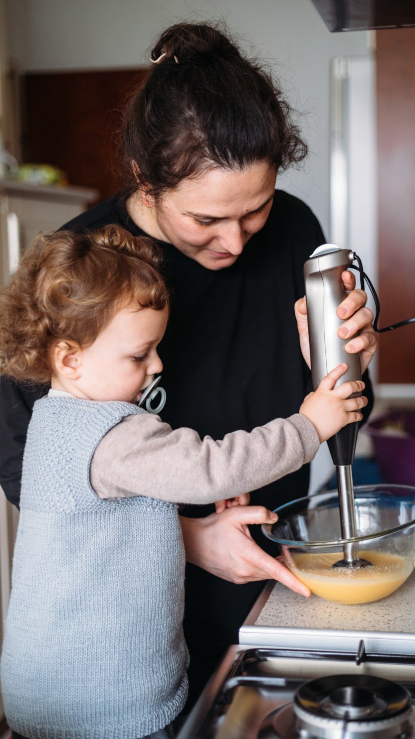 Mom and son making cake for mothers day