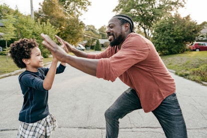 step dad and step son playing  together outdoor in a list of blended family quotes