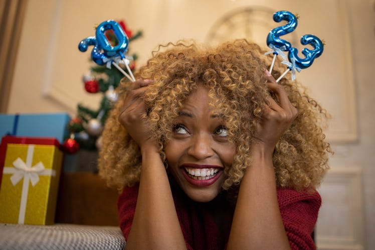 A woman on New Year's Eve needs 2022 recap captions for saying hello to 2023.
