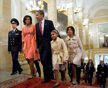 US President Barack Obama, his wife Michelle and their daughters Sasha and Malia walk.