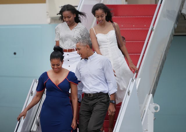 President Barack Obama, First Lady Michelle Obama, and their daughters, Sasha (back left) and Malia,...