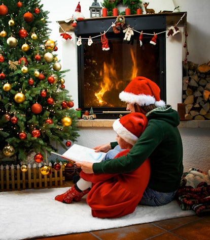 Mother and Daughter near the Christmas Tree and Fireplace in article about rules for elf on the shel...