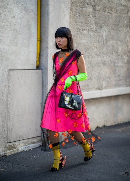 Susie Lau wearing neon opera gloves