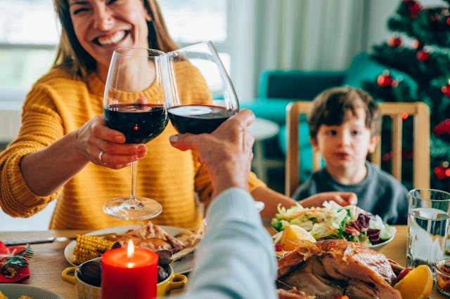 Young family at the holidays around dining room table