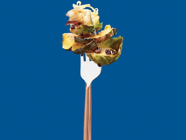 Brussel Sprout Recipe on Fork over Blue Background