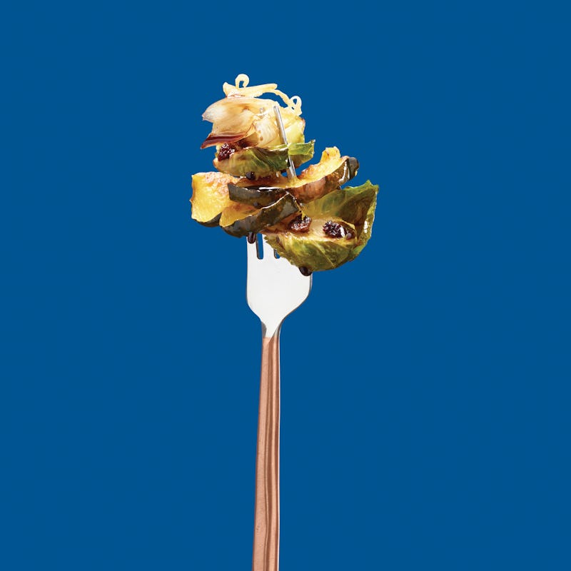 Brussel Sprout Recipe on Fork over Blue Background