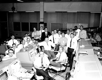 Photograph of the Mission Control Center flight support team for the Apollo 7 mission, Houston, Texa...