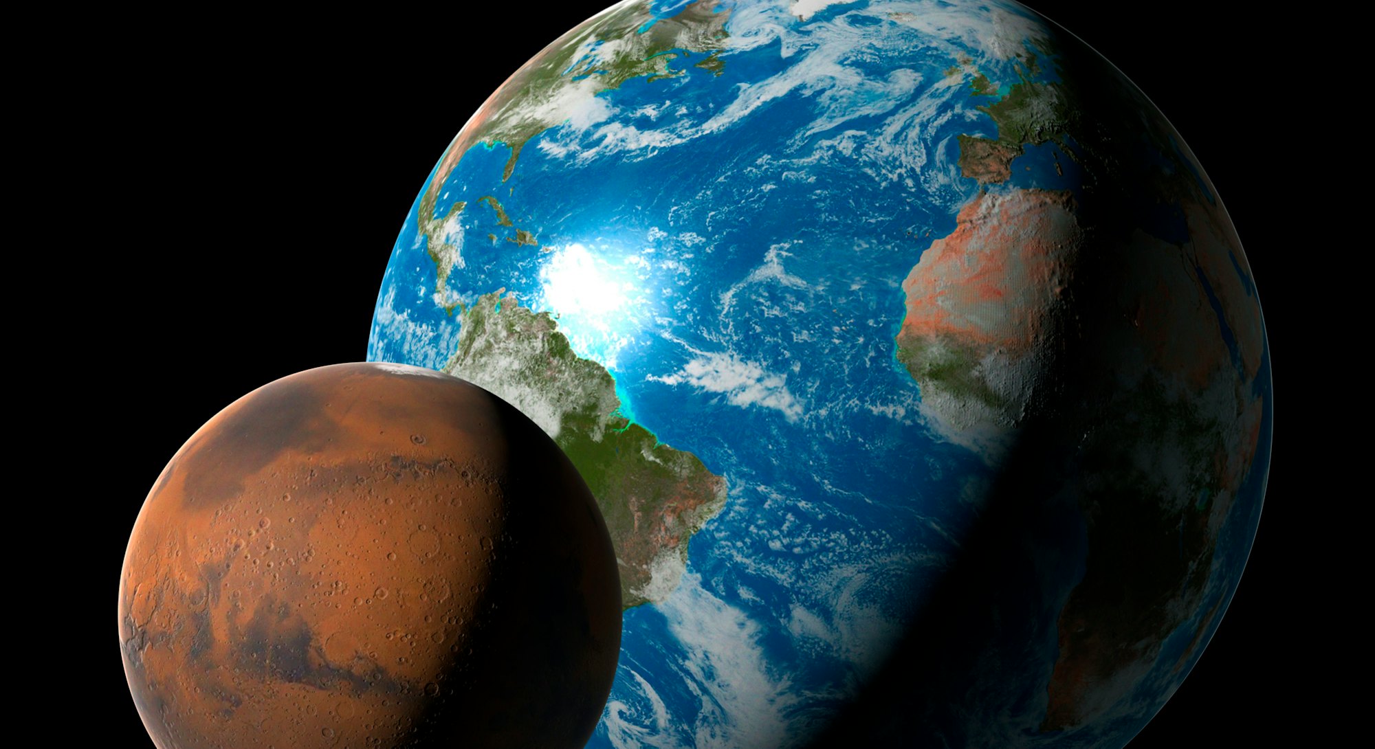 Computer illustration comparing the size of Mars (left) with that of the Earth. Mars' diameter is 53...