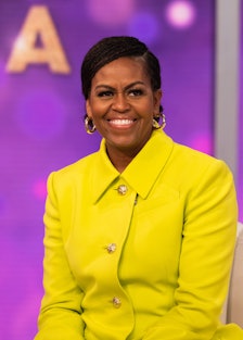 Michelle Obama wearing a yellow suit jacket