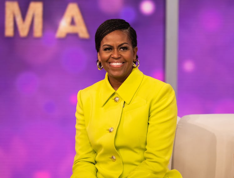 Michelle Obama wearing a yellow suit jacket