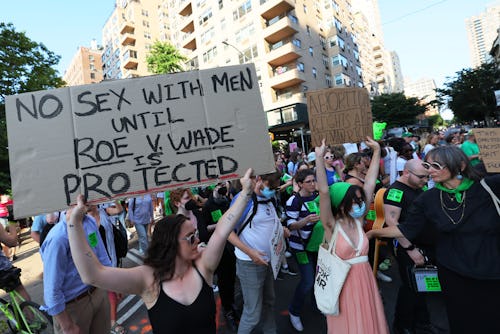 NEW YORK, NEW YORK - JUNE 24: People march as they protest the Supreme Courts 6-3 decision in the Do...