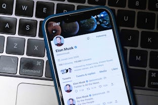 JAPAN - 2022/11/15: In this photo illustration, Elon Musk's Twitter account is seen displayed on a s...