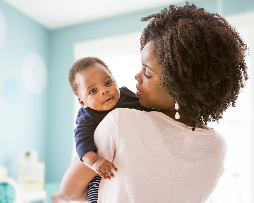 a mom and baby snuggling in a list of "K" boy names