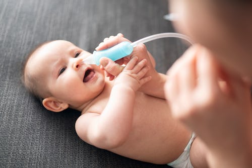 Newborn baby and nose drops