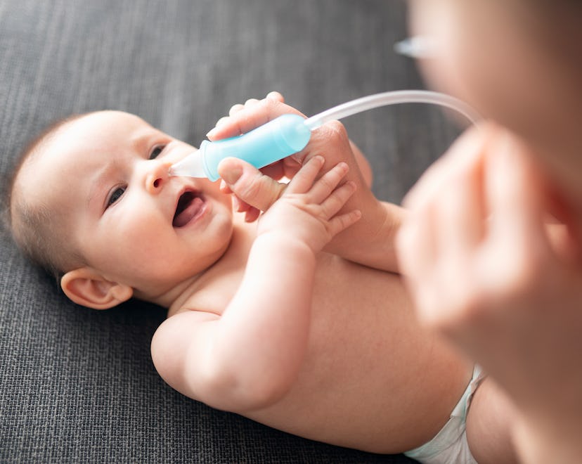 Newborn baby and nose drops