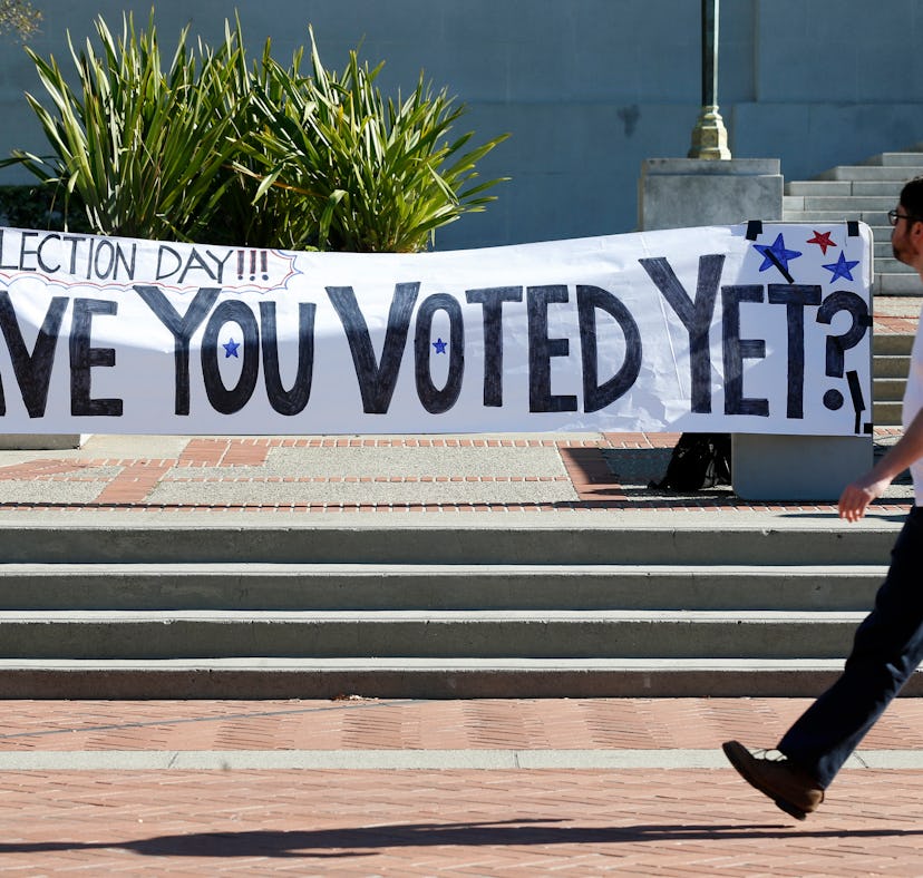Students stroll past an Election Day rally on Sproul Plaza organized by the CALPIRG students organiz...