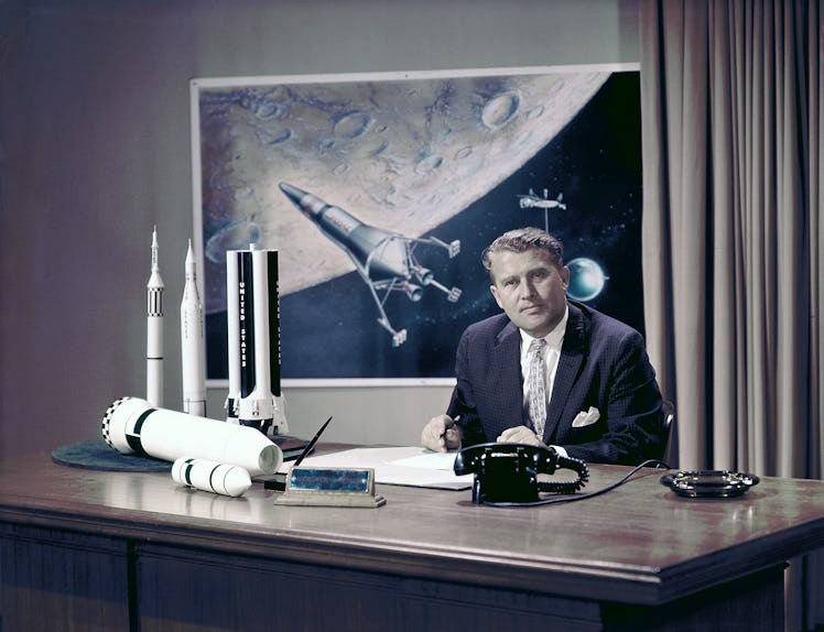 Photo of Marshall Space Flight Center (MSFC) Director Dr. Wernher von Braun at his desk with moon la...