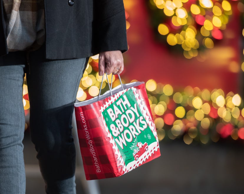 NEW YORK, NEW YORK - NOVEMBER 23: A person carries a shopping bag outside Macy's in Herald Square on...