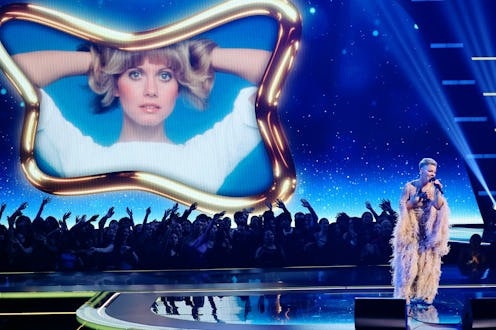 LOS ANGELES, CALIFORNIA - NOVEMBER 20: (L-R) An image of the late Olivia Newton-John is displayed on...