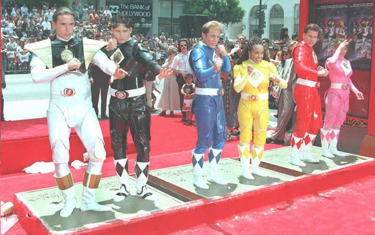 HOLLYWOOD, :  The Mighty Morphin Power Rangers strike poses as they stand in cement 22 June at Mann'...