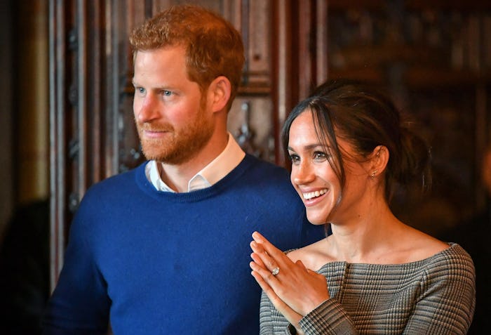 CARDIFF, WALES - JANUARY 18:  Prince Harry and Meghan Markle watch a performance by a Welsh choir in...