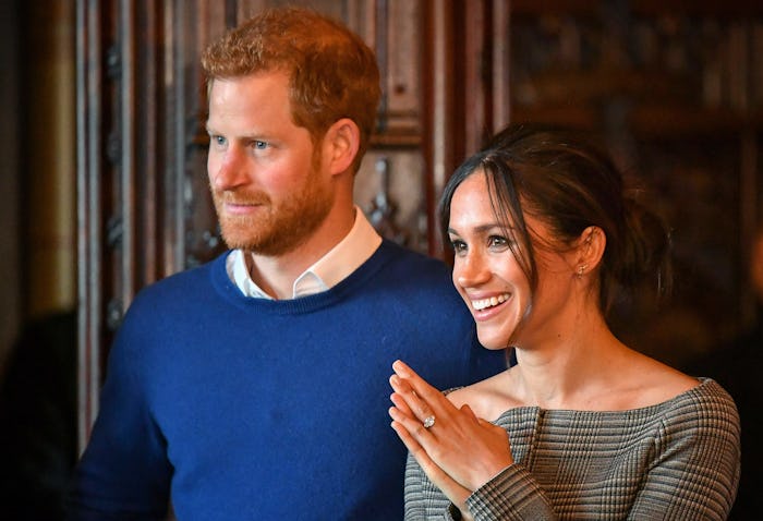 CARDIFF, WALES - JANUARY 18: Prince Harry and Meghan Markle watch a performance by a Welsh choir in...