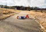 a crying toddler in an article about why do toddlers throw themselves on the ground?