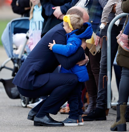 Prince William hugged a little boy.