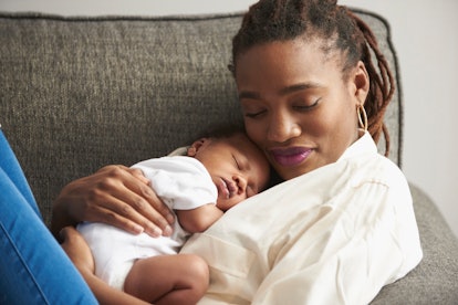 a mom and baby snuggling in an article about baby growth spurts and if babies sleep more during grow...