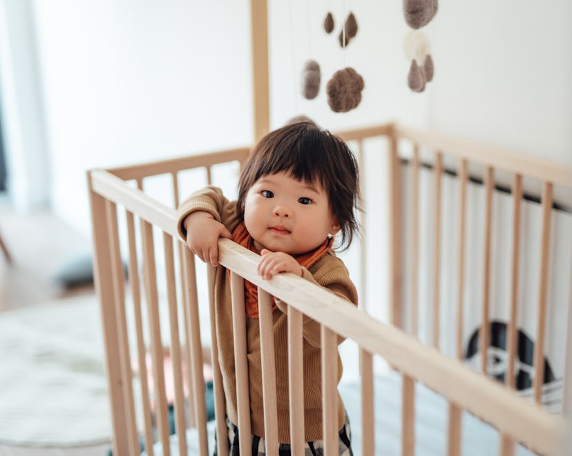 Headshot of cheerful baby girl baby growth spurts