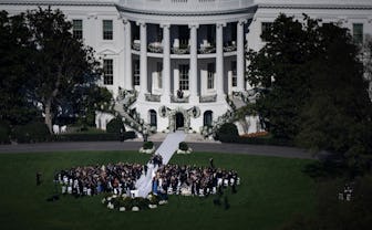 Naomi Biden, 28, granddaughter of US President Joe Biden, and Peter Neal, 25, walk to the White Hous...