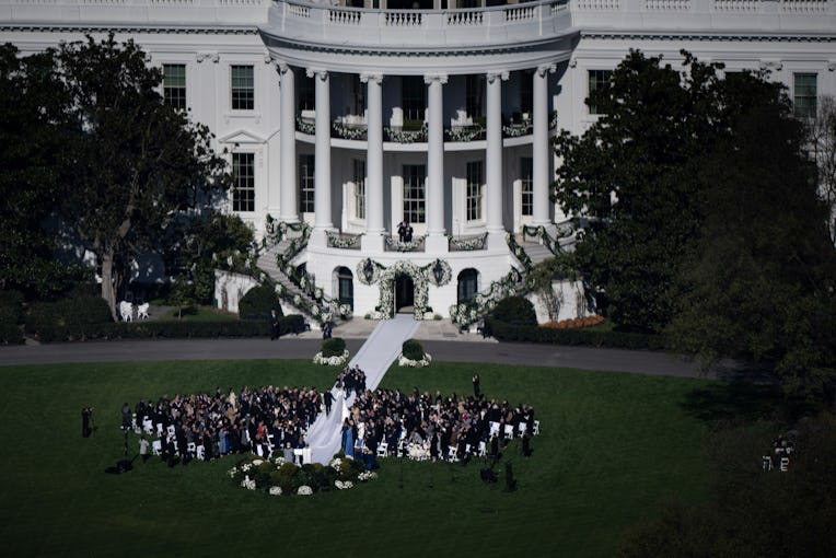 Naomi Biden, 28, granddaughter of US President Joe Biden, and Peter Neal, 25, walk to the White Hous...