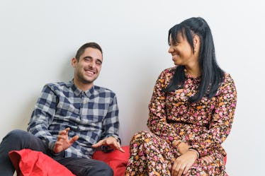 Two co-workers of different ethnicities talking and having fun after work