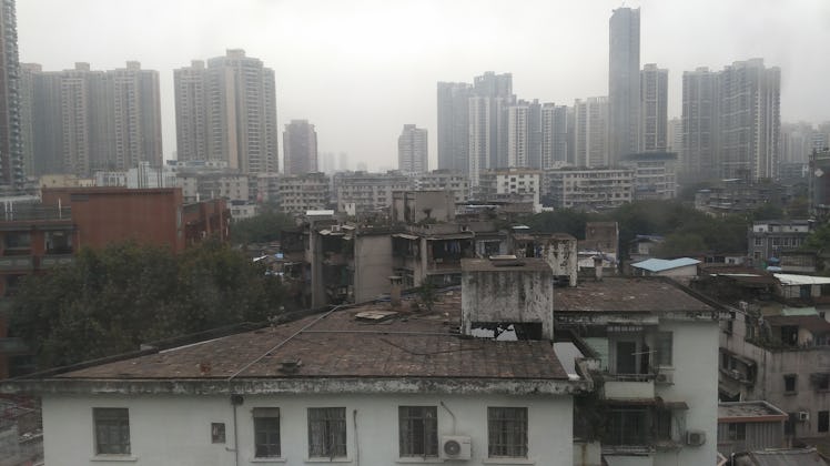 Guangzhou, China - February 12, 2016: Early morning in Guangzhou city in winter. The sky is heavy an...