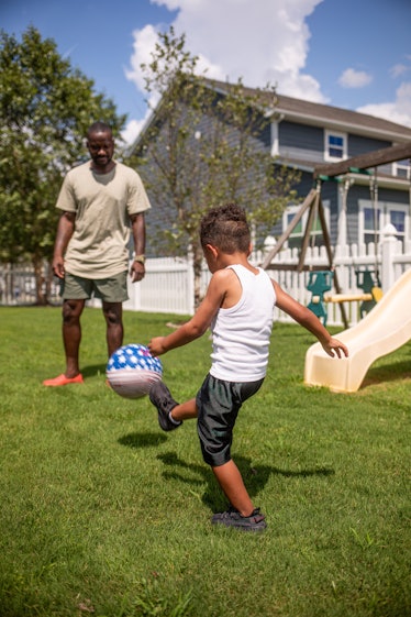 Boy playing Soccer with Dad, Passing