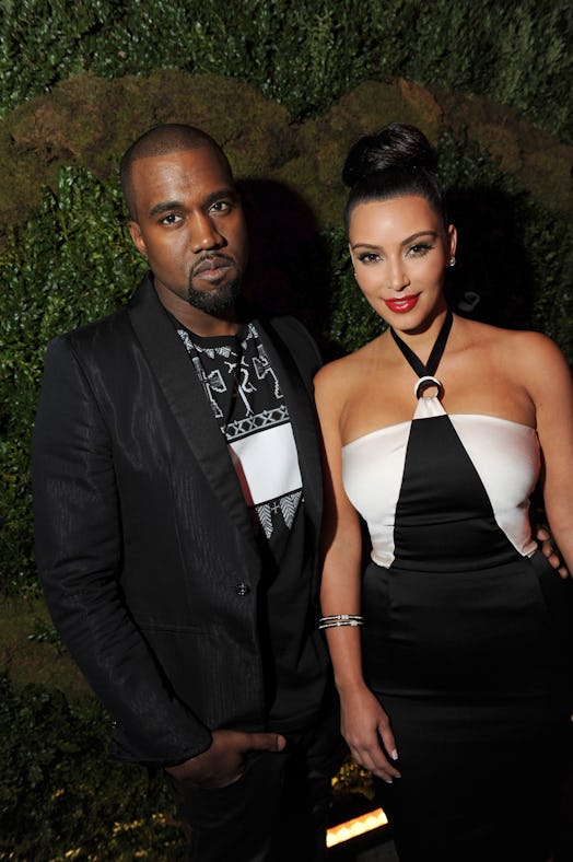 Kanye West (L) and Kim Kardashian attend Chanel's Tribeca Film Festival dinner at Odeon. Kardashian ...
